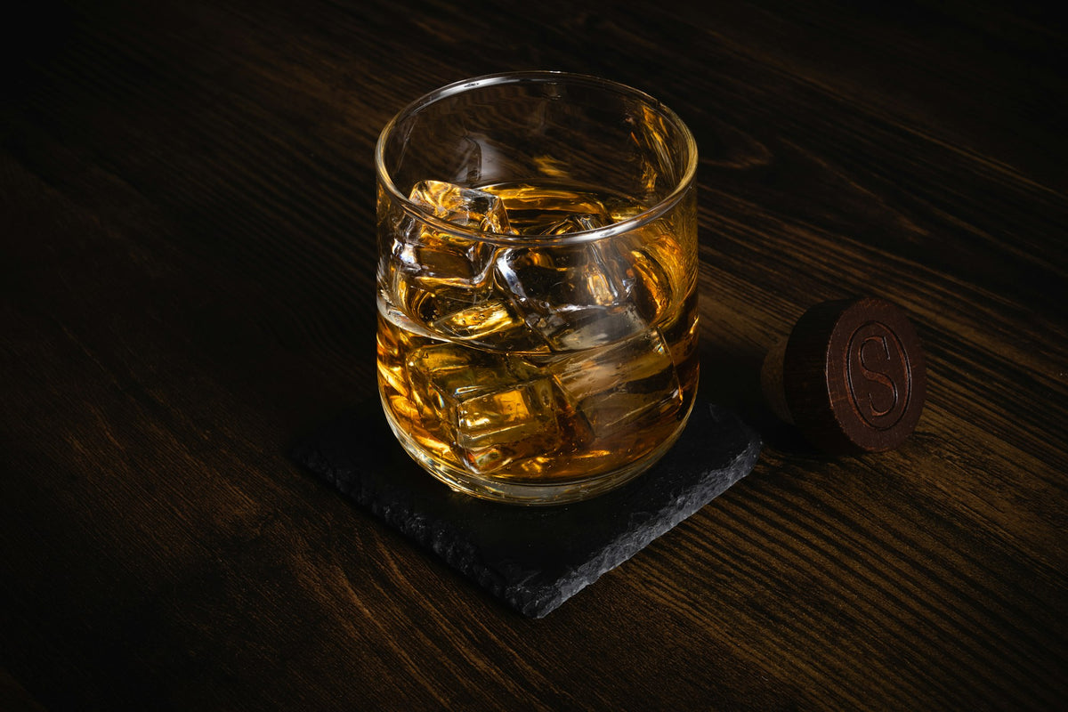 Glass of whiskey on a wooden table, gifts for him