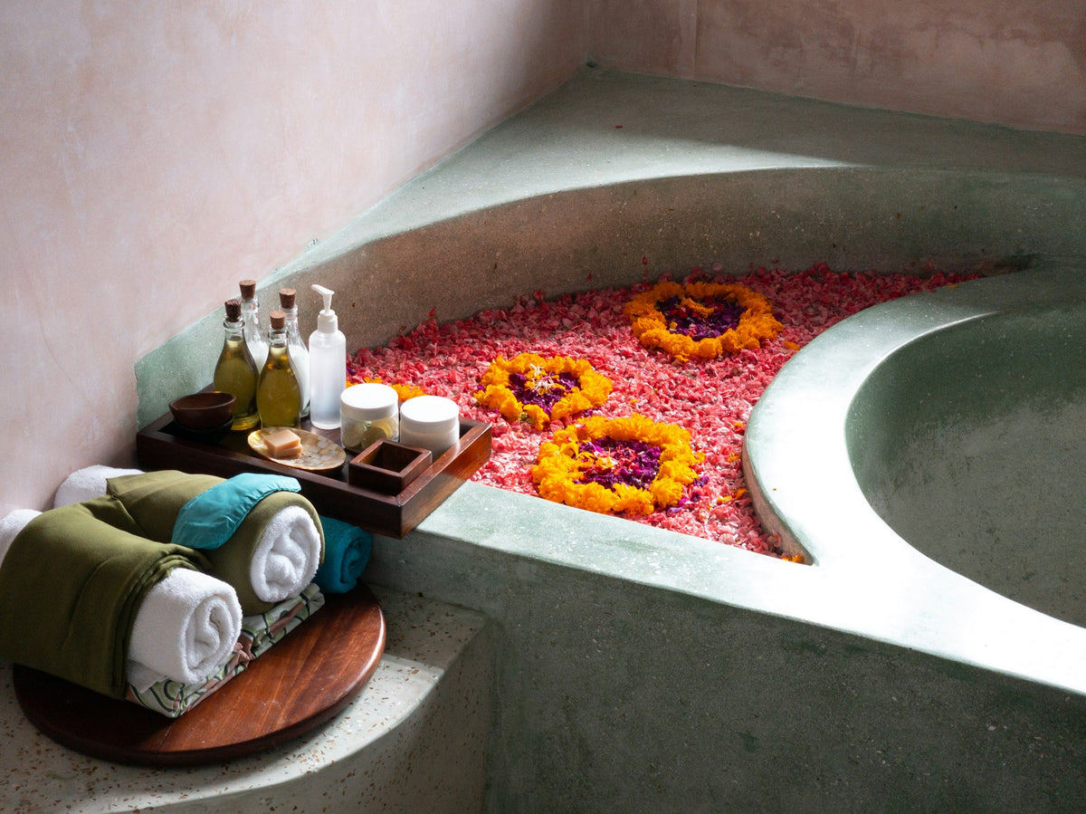 Bathtub with a tray of flowers, self-care gifts for her